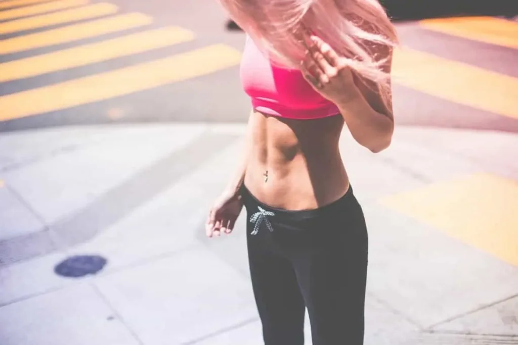 Woman with toned stomach after LA-EMS Body Sculpting Treatment Newmarket